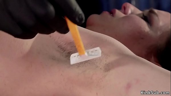 Master trims underarms to locked marionette