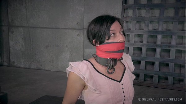 Petite Dark haired in Metal Restrain bondage