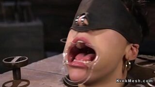 Dark haired marionette in suspension frigged and caressed