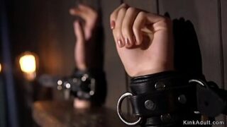 Blonde victim in metal device restrain bondage gets spanked then caned and shocked with bug zapper