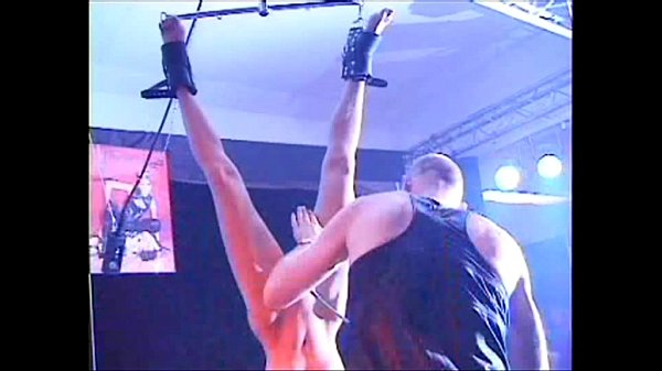 Fetish Club Penalty On Stage of blonde slavegirl in restrain bondage and whipping