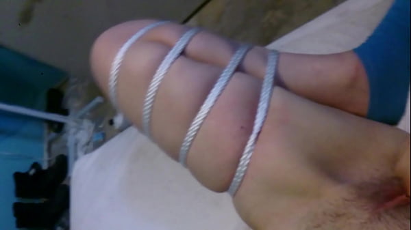 Tied up nubile gets toyed with