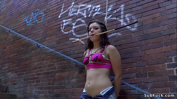 Petite brown-haired inhales big dick in club